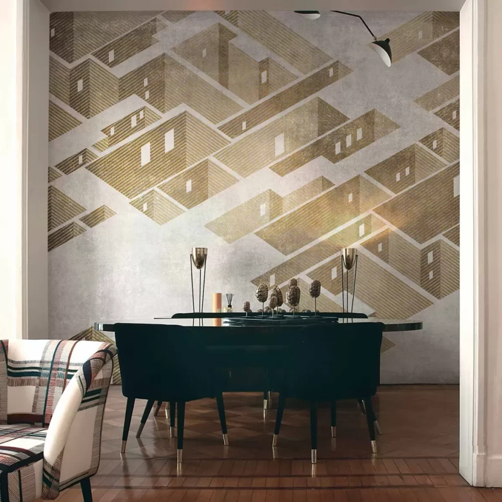 Metropolis von Tecnografica: geometrisch gezeichnete Baukörper in warmen Gold- und Grautönen hinter einem Esstisch.