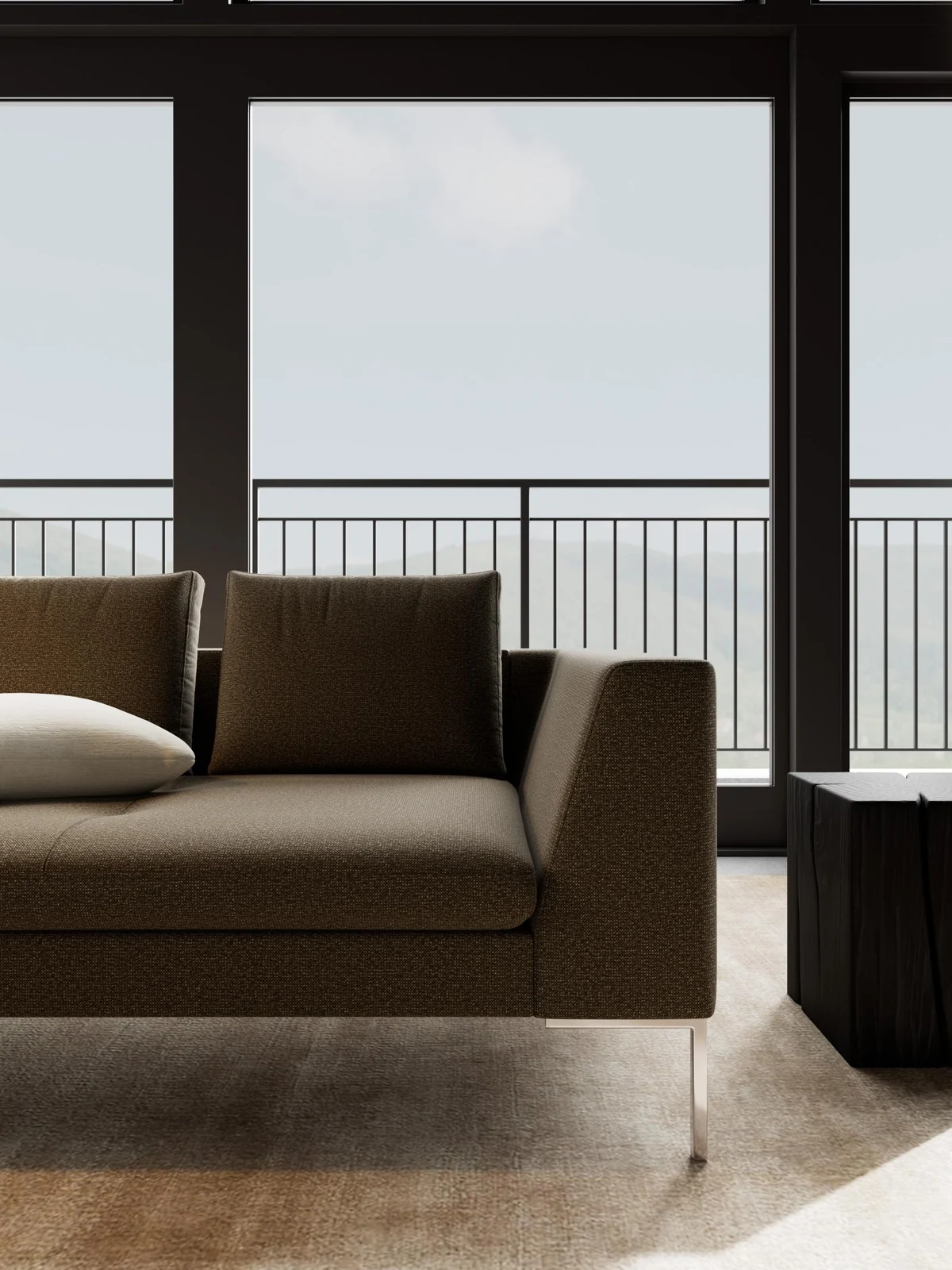 Detail des Loano-Sofas von Flexlux mit dunklem Bezug, gerader Armlehne und schlankem Metallfuß.