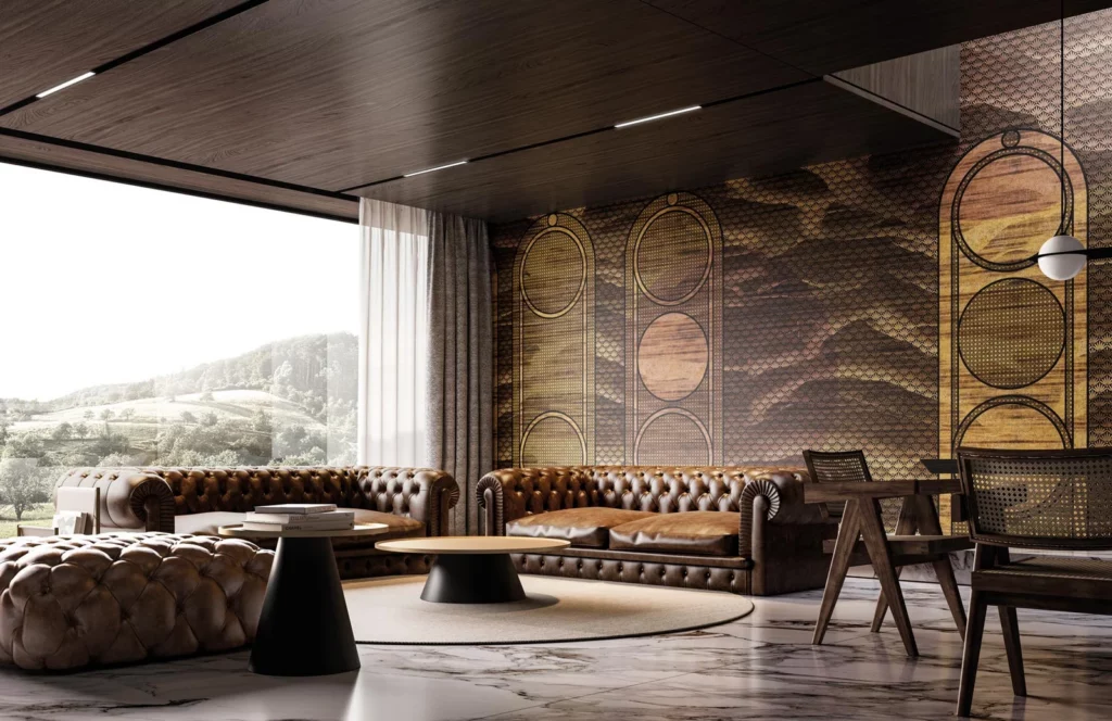 Goldfarbene Kreise und geometrische Felder an der Wand eines großzügigen Wohnbereichs mit Ledersofas.